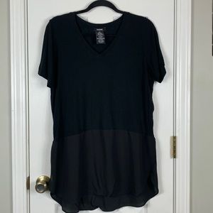 Premise black short sleeved top with a sheer layer around the bottom. Size large